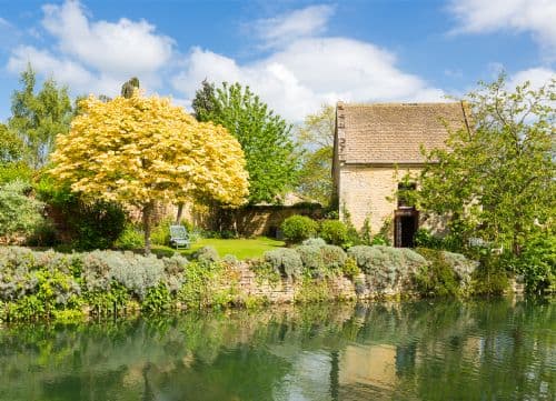 The Dovecote cottage exterior beside the garden